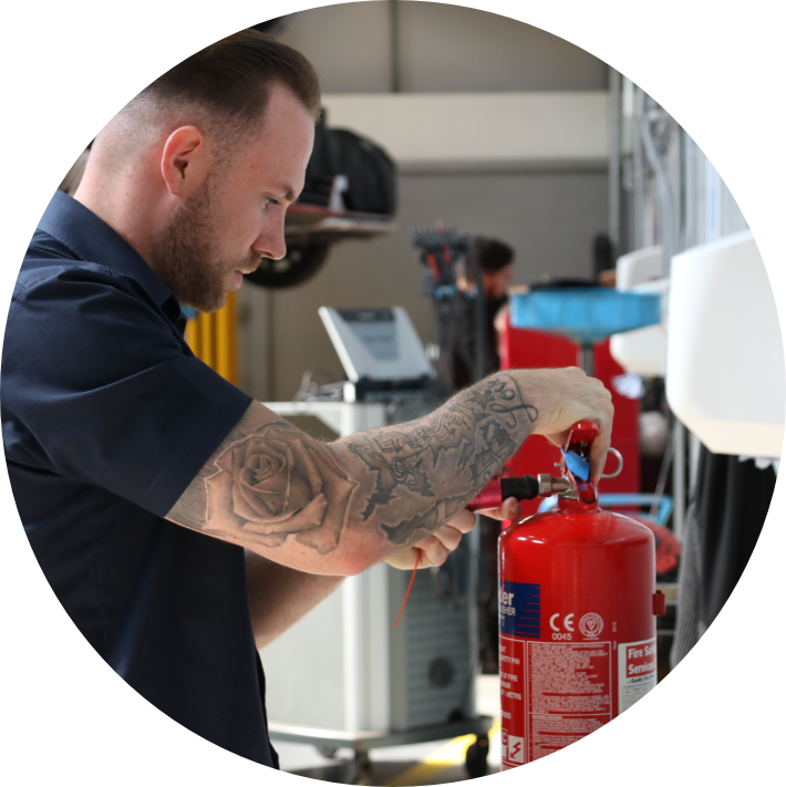 Man performing extinguishger inspection