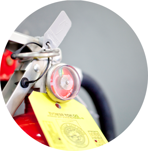Fire extinguisher with inspection tag